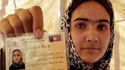 Afghan woman with voter card April 2014 election