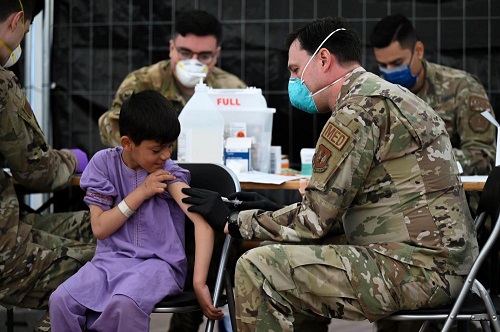 Airman administers measles vaccine at Ramstein Air Base.