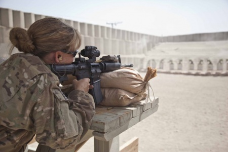 CST Soldier fires her rifle on range in Afghanistan